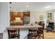 Modern kitchen bar area with granite countertops and stainless steel appliances at 218 Kinvara Ct, Wake Forest, NC 27587