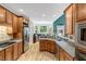 Spacious kitchen features stainless steel appliances, hardwood floors, and granite counters at 218 Kinvara Ct, Wake Forest, NC 27587