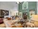 Living room boasts a fireplace, tall ceilings and views to the kitchen area at 218 Kinvara Ct, Wake Forest, NC 27587