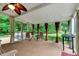An outdoor porch with curtains and chairs. Perfect for relaxing outside at 218 Kinvara Ct, Wake Forest, NC 27587