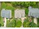 Aerial view of a well-maintained home with a neatly landscaped yard and surrounding greenery at 221 Roebling Ln, Cary, NC 27513