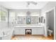 Bright and spacious primary bathroom features dual sinks, tub and separate vanity area at 221 Roebling Ln, Cary, NC 27513
