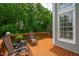 Spacious deck furnished with comfortable lounge chairs, perfect for enjoying the serene, wooded views at 221 Roebling Ln, Cary, NC 27513