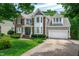 Charming two-story home with manicured lawn, brick accents, and an attached two car garage at 221 Roebling Ln, Cary, NC 27513