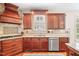 Gourmet kitchen with custom cabinetry, granite countertops, and stainless steel appliances at 221 Roebling Ln, Cary, NC 27513