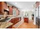 Well-appointed kitchen featuring granite counters, stainless appliances, and breakfast nook at 221 Roebling Ln, Cary, NC 27513
