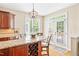 Breakfast nook featuring granite countertops, stainless appliances, and natural light at 221 Roebling Ln, Cary, NC 27513