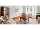 Cozy living room with hardwood floors, large windows, and neutral color palette at 221 Roebling Ln, Cary, NC 27513