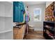Walk-in closet with custom shelving for shoes, clothes, and storage, with a window offering natural light at 2229 Neills Creek Rd, Lillington, NC 27546