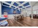 Open dining area with coffered ceiling, blue walls, and seamless connection to the kitchen at 2229 Neills Creek Rd, Lillington, NC 27546