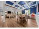 Stylish dining room featuring coffered ceiling, blue accent wall, and seamless access to the living area at 2229 Neills Creek Rd, Lillington, NC 27546