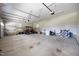 Spacious garage with elevated wood platforms, ample storage, and a red golf cart parked inside at 2229 Neills Creek Rd, Lillington, NC 27546