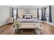 Comfortable main bedroom with large windows, hardwood floors, and decorative accents at 2229 Neills Creek Rd, Lillington, NC 27546