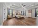 Spacious main bedroom with tray ceiling, hardwood floors, large windows, and decorative accents at 2229 Neills Creek Rd, Lillington, NC 27546