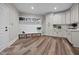 Mudroom features ample cabinet storage, a coat rack, and 'HOME' decorative baskets for organization at 2229 Neills Creek Rd, Lillington, NC 27546