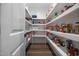 Walk-in pantry with white shelving, providing plenty of storage space for food and household items at 2229 Neills Creek Rd, Lillington, NC 27546