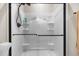 Modern stand-up shower featuring new shower doors, hardware and shelving space at 2229 Neills Creek Rd, Lillington, NC 27546