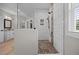 Walk-in shower featuring a pebble floor, white tile walls, and a glass partition for a modern design at 2229 Neills Creek Rd, Lillington, NC 27546