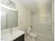 Bathroom with a large vanity, mirror, and combined tub and shower with white tile at , Holly Springs, NC 27540