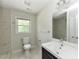 Modern bathroom with large mirror, stylish vanity and tiled walk-in shower at , Holly Springs, NC 27540