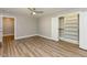 Bedroom with wood-look floors, large closet and open doorway to another room at , Holly Springs, NC 27540