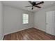 Bright bedroom with neutral walls, wood-look flooring, and a ceiling fan at , Holly Springs, NC 27540