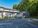 Rear exterior showcasing the private entrance, complemented by lush landscaping at , Holly Springs, NC 27540
