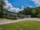 Gray townhouses showcase a lush, green lawn complemented by a long driveway and inviting front porches at , Holly Springs, NC 27540