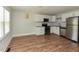 Spacious kitchen with stainless appliances, white cabinetry, and ample natural light at , Holly Springs, NC 27540