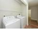 Convenient laundry area with washer, dryer, and shelving for storage at , Holly Springs, NC 27540
