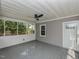 Enclosed patio with fan and view of backyard at , Holly Springs, NC 27540