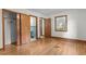 Bright bedroom featuring hardwood floors, white walls, and an ensuite bathroom with classic blue tile at 2291 Gentry Ridge Rd, Roxboro, NC 27574