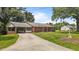 Charming brick home featuring a covered carport and a well-maintained lawn at 2291 Gentry Ridge Rd, Roxboro, NC 27574