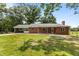 A cozy single-story brick home with a covered carport and inviting curb appeal at 2291 Gentry Ridge Rd, Roxboro, NC 27574