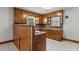 Traditional kitchen with ample wood cabinetry and tile floors at 2291 Gentry Ridge Rd, Roxboro, NC 27574