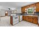 Open kitchen design with classic wood cabinets and vintage appliances at 2291 Gentry Ridge Rd, Roxboro, NC 27574