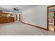 Spacious living room with unique tile flooring leading to a kitchen area at 2291 Gentry Ridge Rd, Roxboro, NC 27574