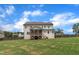 Large backyard featuring a screened porch, lush green lawn, and plenty of space for outdoor enjoyment at 2300 Ginger Gold Court, Apex, NC 27539