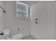 Clean bathroom with toilet, window, and shower with curtain at 2300 Ginger Gold Court, Apex, NC 27539