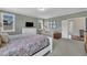 Comfortable bedroom featuring a cozy seating area, soft lighting, and ample space for relaxation and rest at 2300 Ginger Gold Court, Apex, NC 27539