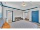 Bedroom with blue trim and multiple doorways for convenient access at 2300 Ginger Gold Court, Apex, NC 27539