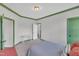 Bedroom featuring green trim and multiple doorways for convenient access at 2300 Ginger Gold Court, Apex, NC 27539