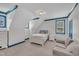 Bedroom with blue trim and vaulted ceiling, featuring a comfortable couch at 2300 Ginger Gold Court, Apex, NC 27539
