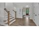 Entryway featuring stairs and a view through to the front door and patterned foyer at 2300 Ginger Gold Court, Apex, NC 27539