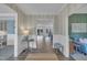 Elegant foyer with wainscoting, hardwood floors, and views into adjacent living spaces at 2300 Ginger Gold Court, Apex, NC 27539