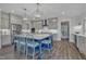 Kitchen with island, featuring pendant lighting, stainless steel appliances, and modern cabinetry at 2300 Ginger Gold Court, Apex, NC 27539