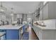 Bright eat-in kitchen featuring an island, marble countertops, modern appliances, and open floor plan at 2300 Ginger Gold Court, Apex, NC 27539