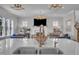 Eat-in kitchen island featuring a marble counter top, stainless steel sink, and bar seating at 2300 Ginger Gold Court, Apex, NC 27539