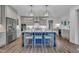 Stylish kitchen island, pendant lighting, and modern stainless steel appliances at 2300 Ginger Gold Court, Apex, NC 27539