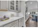 Kitchen details including marble counters, subway tile, and modern cabinetry with gold hardware at 2300 Ginger Gold Court, Apex, NC 27539
